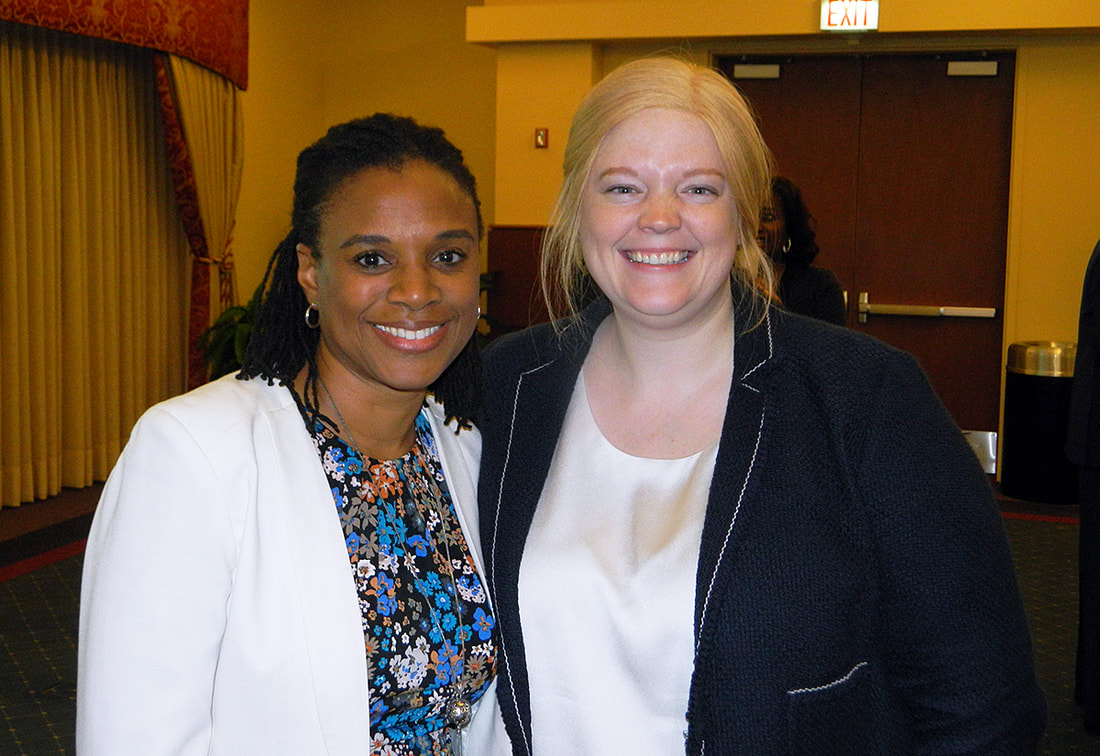Team members, Audra and Lauren, attend a healthcare leadership event.