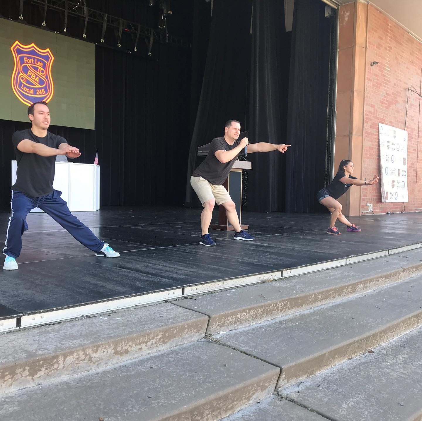 Leading the crowd in some basic exercises at the Fort Lee PBA 5K