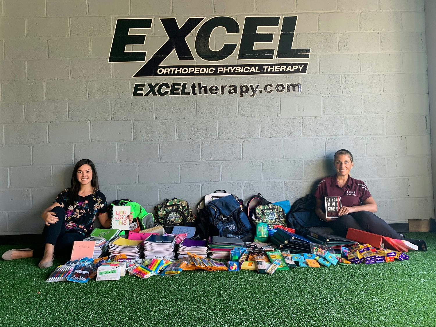 Collecting school supplies at our Livingston office with Clinic Director Caitlin Coriddi and patient Andrea