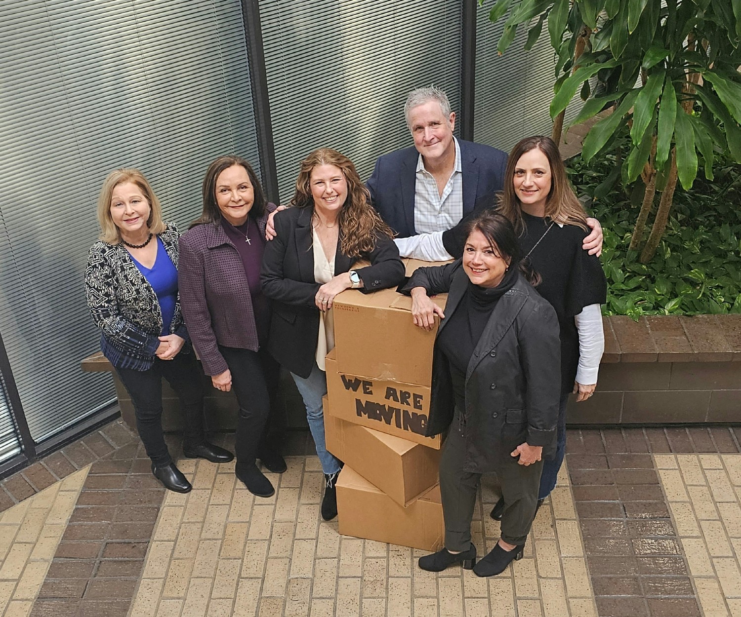 A group of Houston employees get ready to move to a new office.