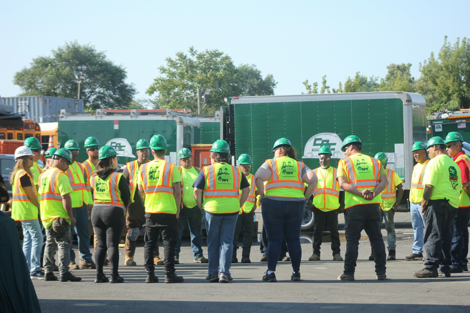 The C.A.C. Shop team gathers for a safety briefing.