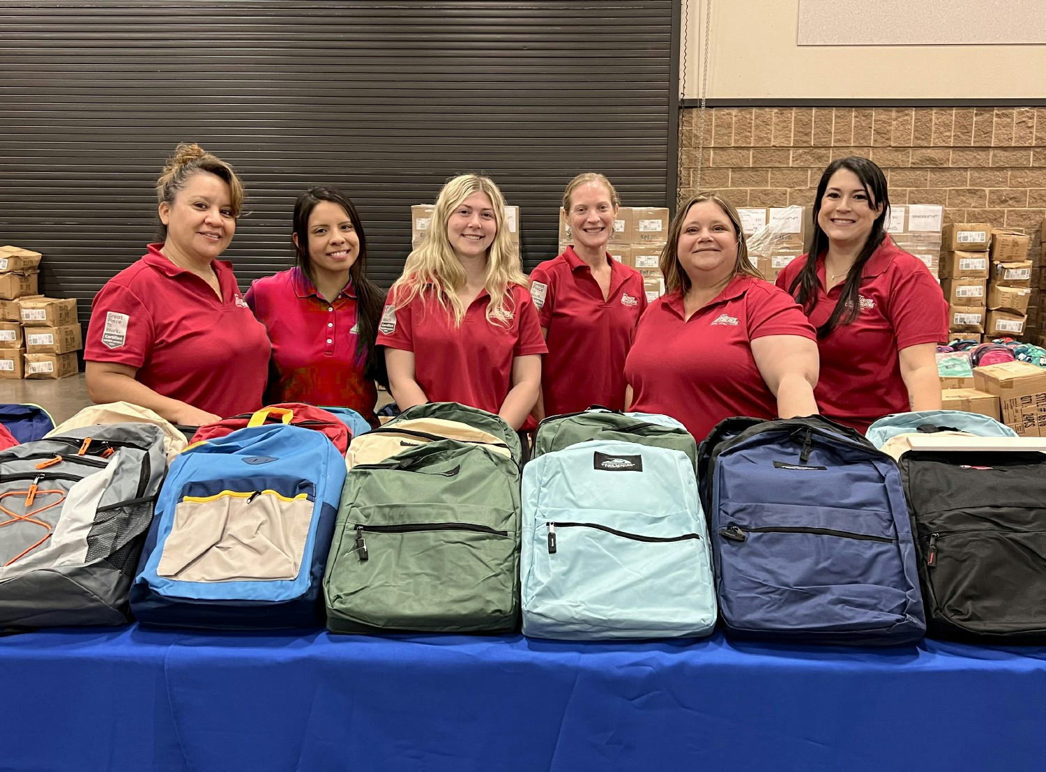 USCU volunteers at Project Back to School, a non-profit providing children with free school supplies and backpacks.
