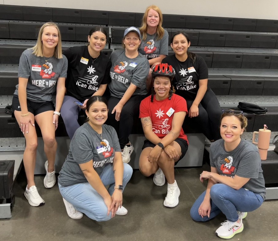 USCU volunteers with YMCA iCanBike program.