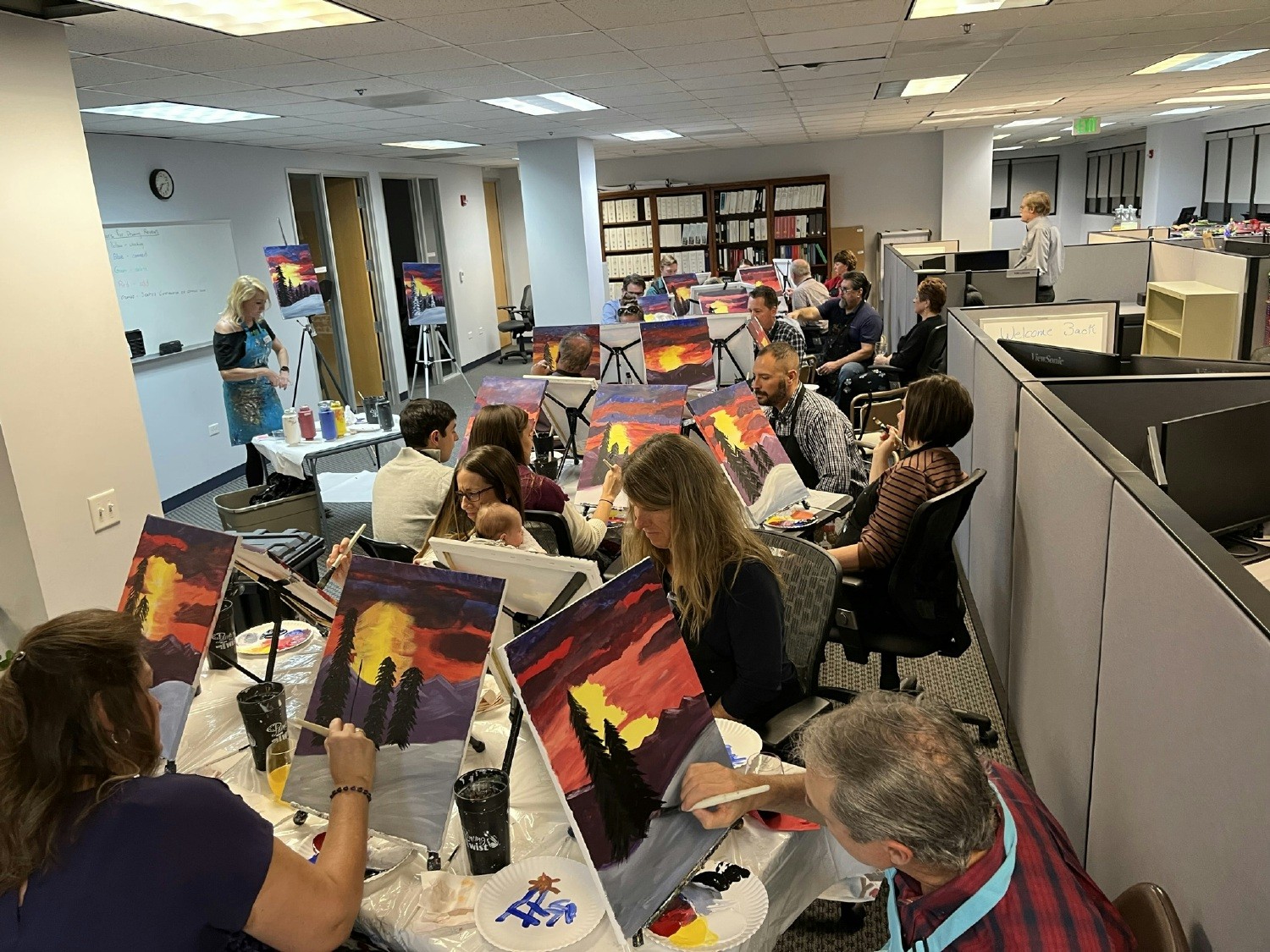 Harris Group's Golden office painted together during their holiday party.