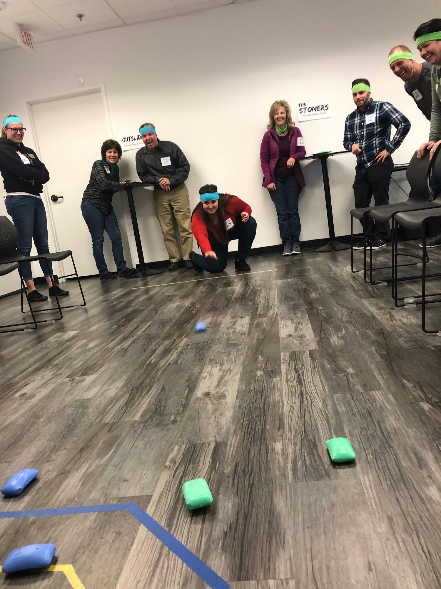 An Ignite Funding staff event doing our version of curling.