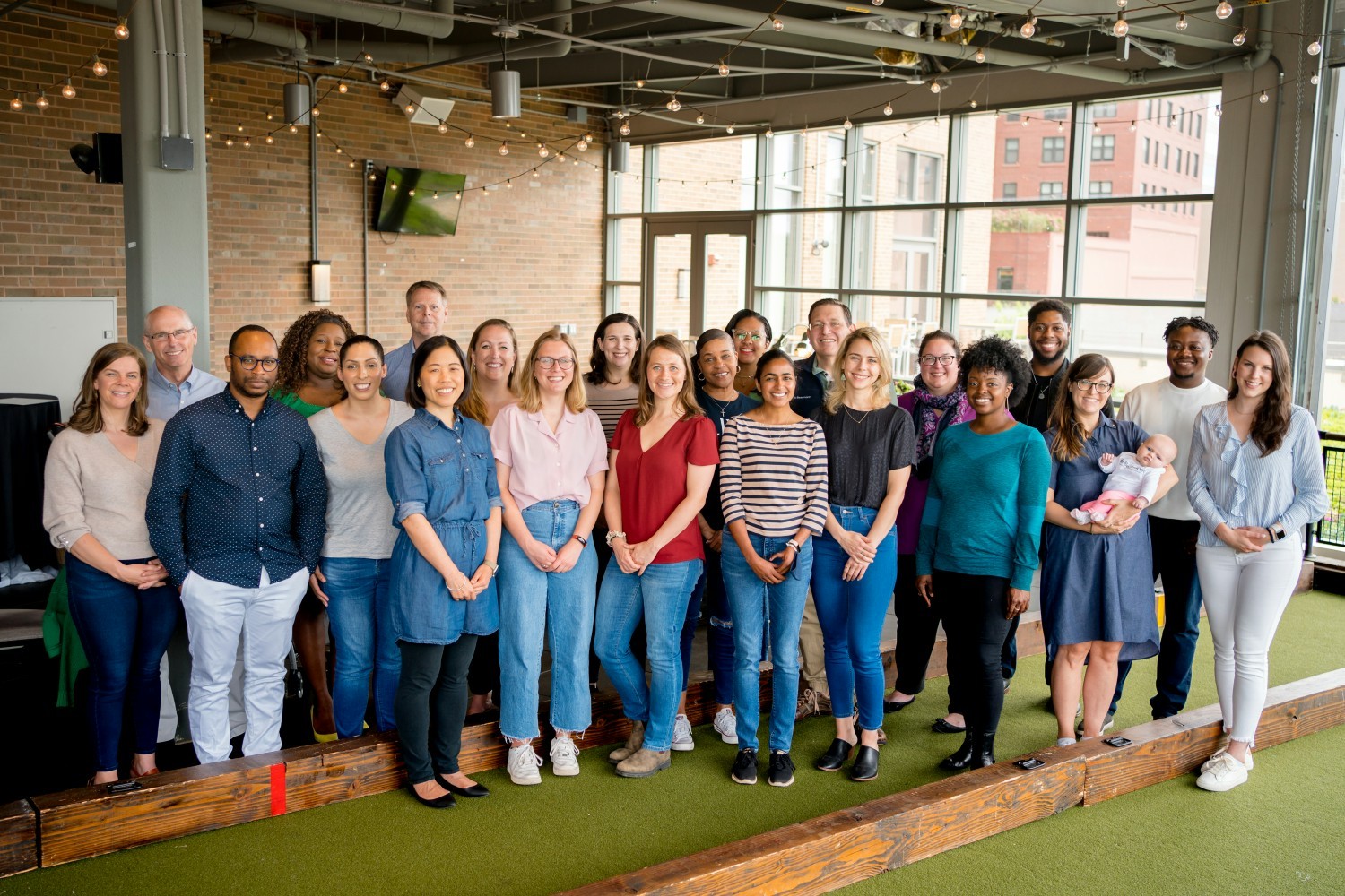 Staff gathered for a local happy hour event