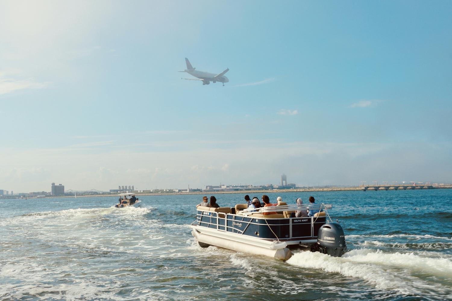 Watching the planes fly in to Logan Airport during a boat ride at Archway's Summer Retreat.