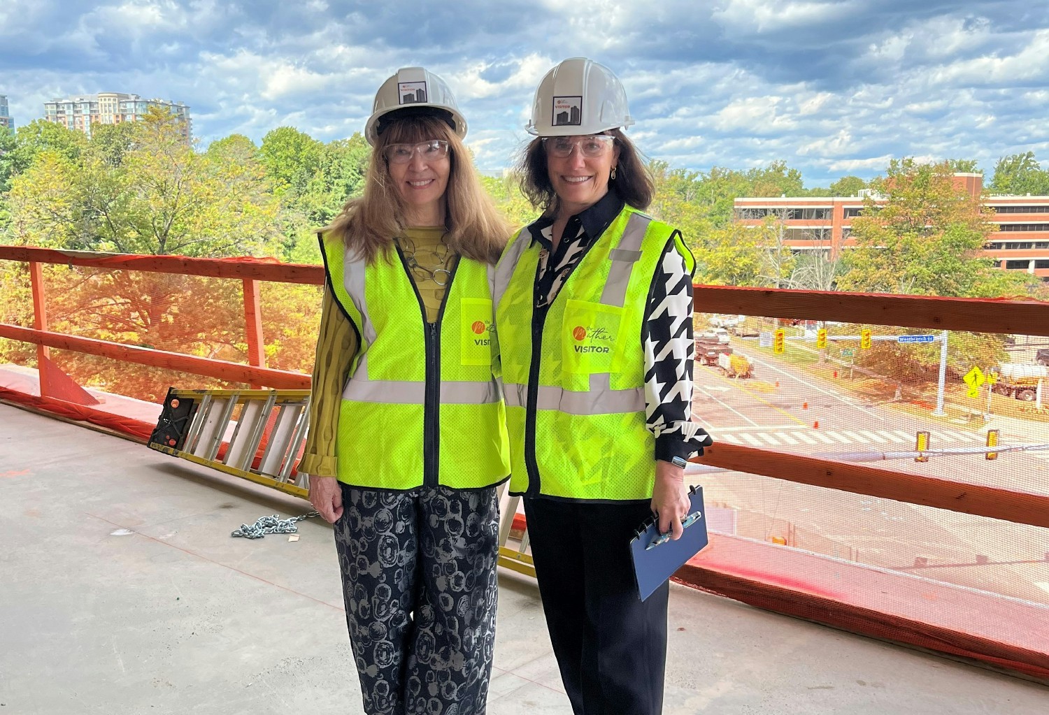 Mather President & CEO Mary Leary with SVP, HR Yvonne Jung, at the future site of The Mather Tysons in Tysons, Virgina.