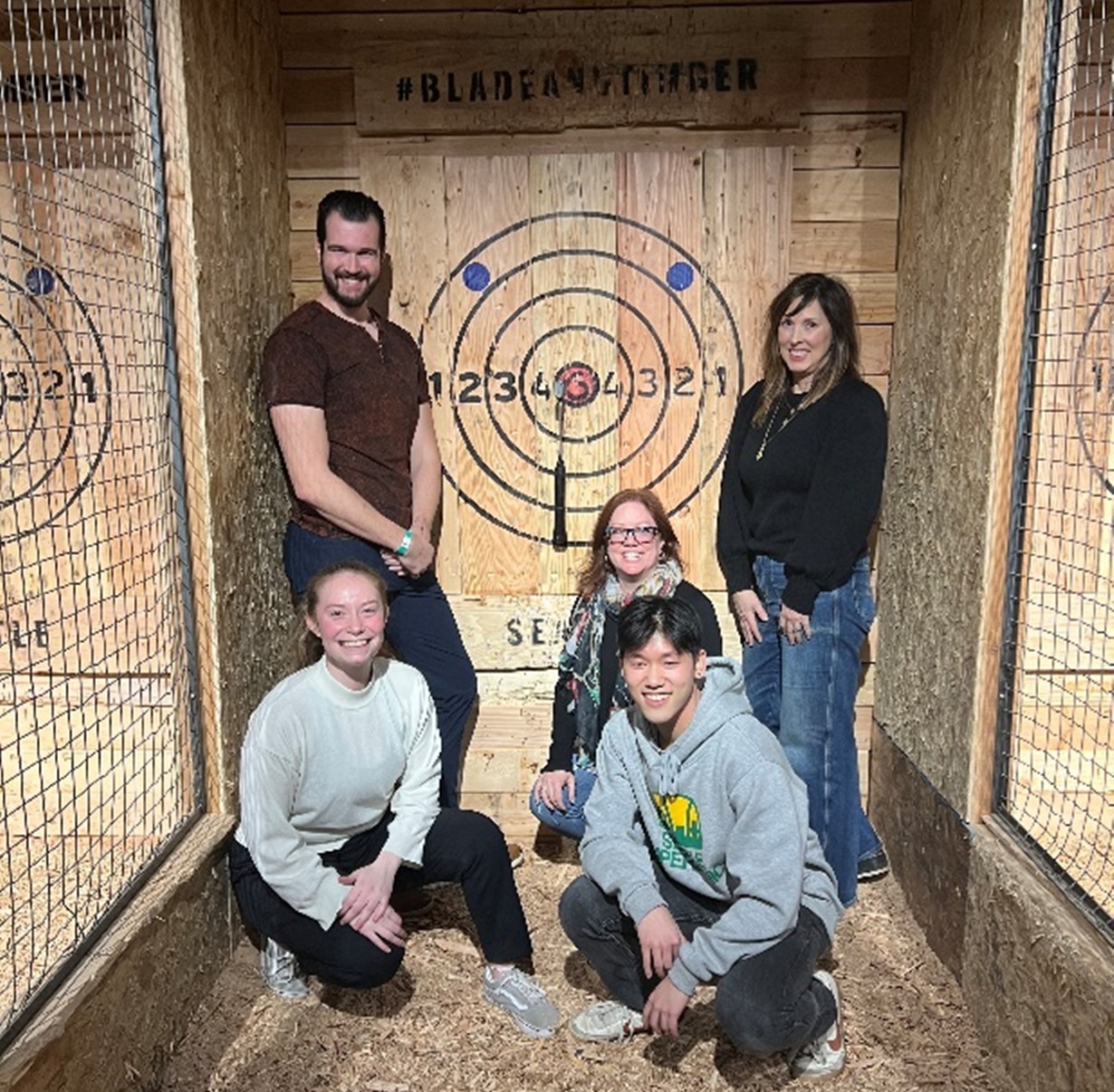 Employees from the Seattle office doing axe throwing as a team building event!