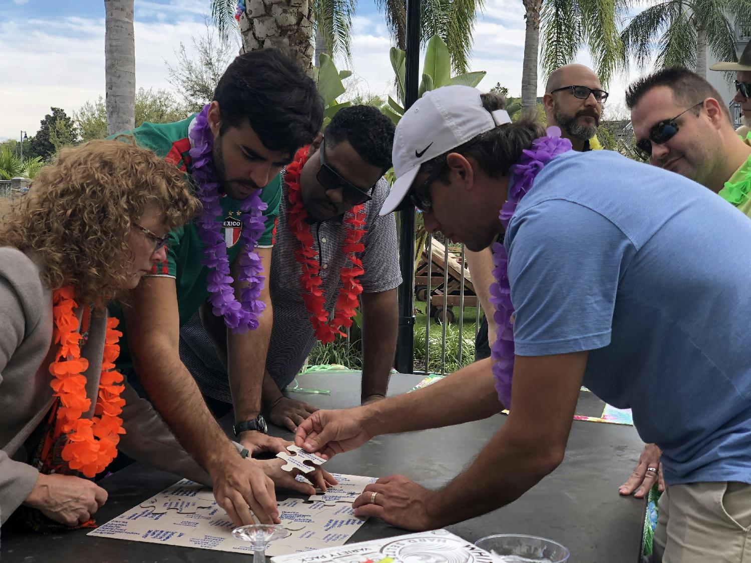 eMindful mates collaborate to put together a puzzle of employee strengths. 