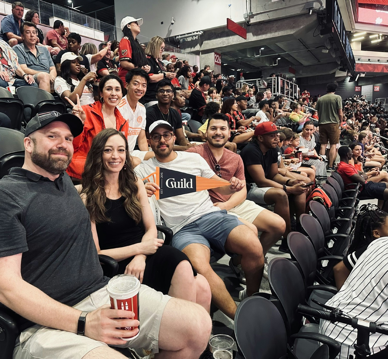 Guilders attend sports event. 