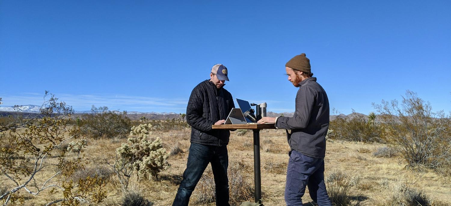 AnLar pushes remote work to extremes. Here two AnLarians cowork CA's Mojave Desert. 