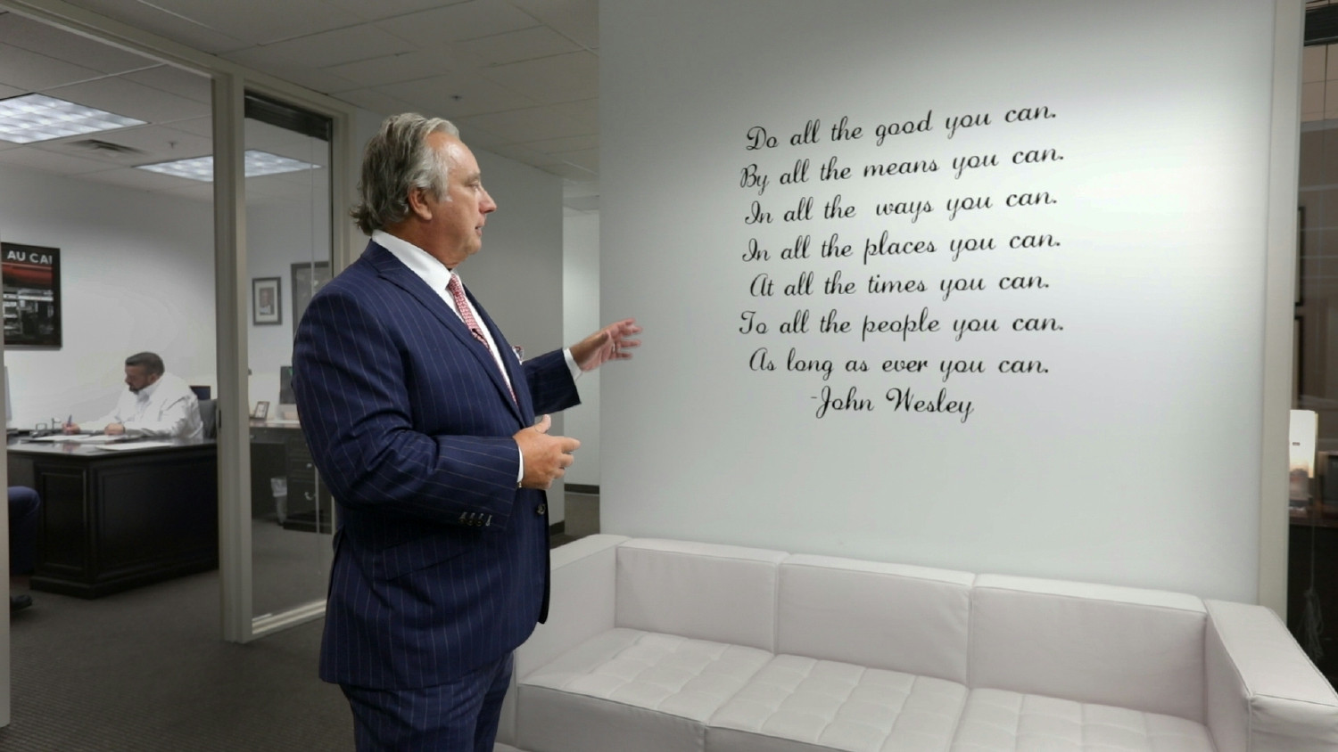 Founder and CEO Chuck McDowell holding a meeting with all Wesley Financial Group staff members.