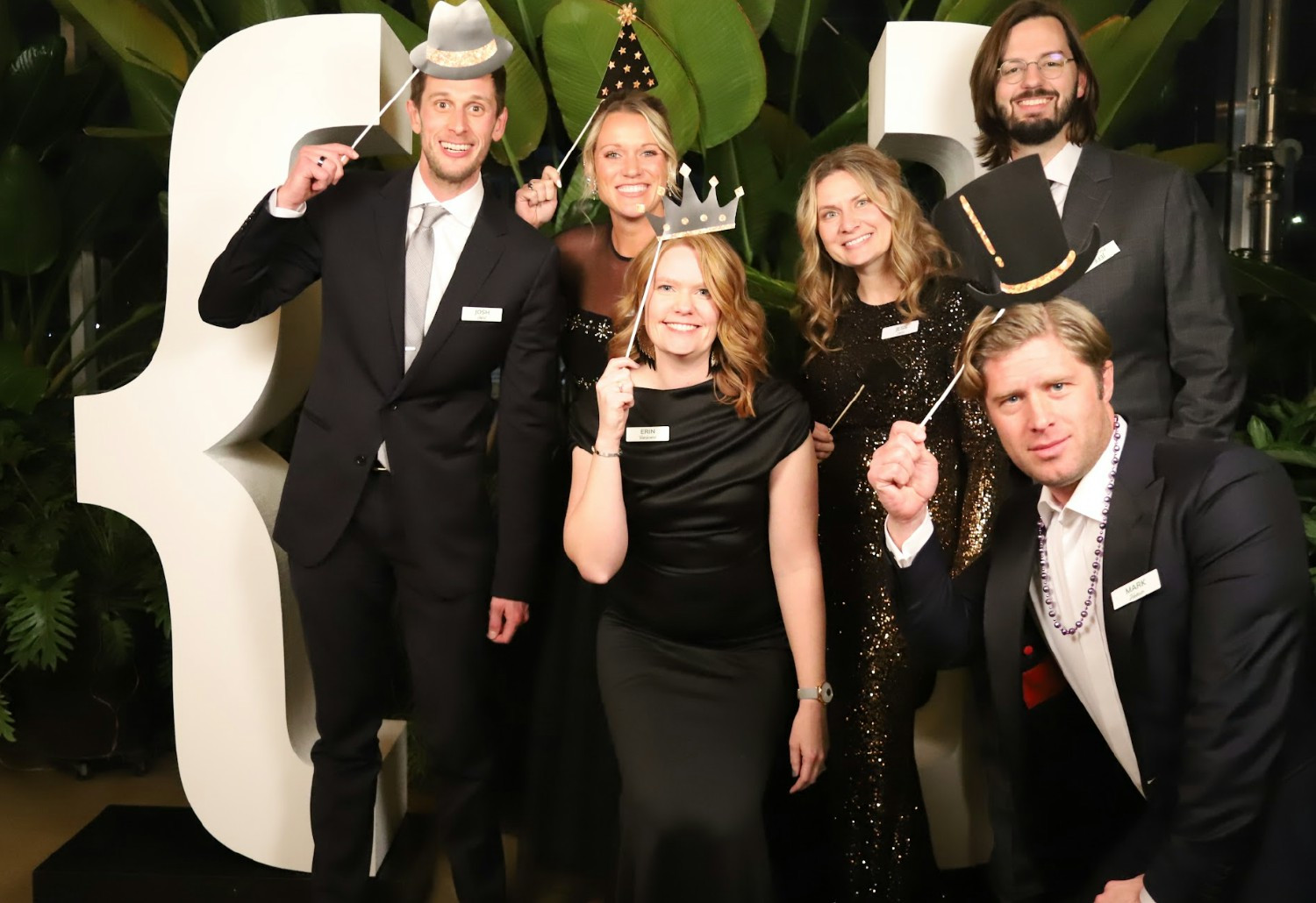 The team enjoys a formal party in celebration of the holidays hosted at the Downtown Grand Rapids Market .