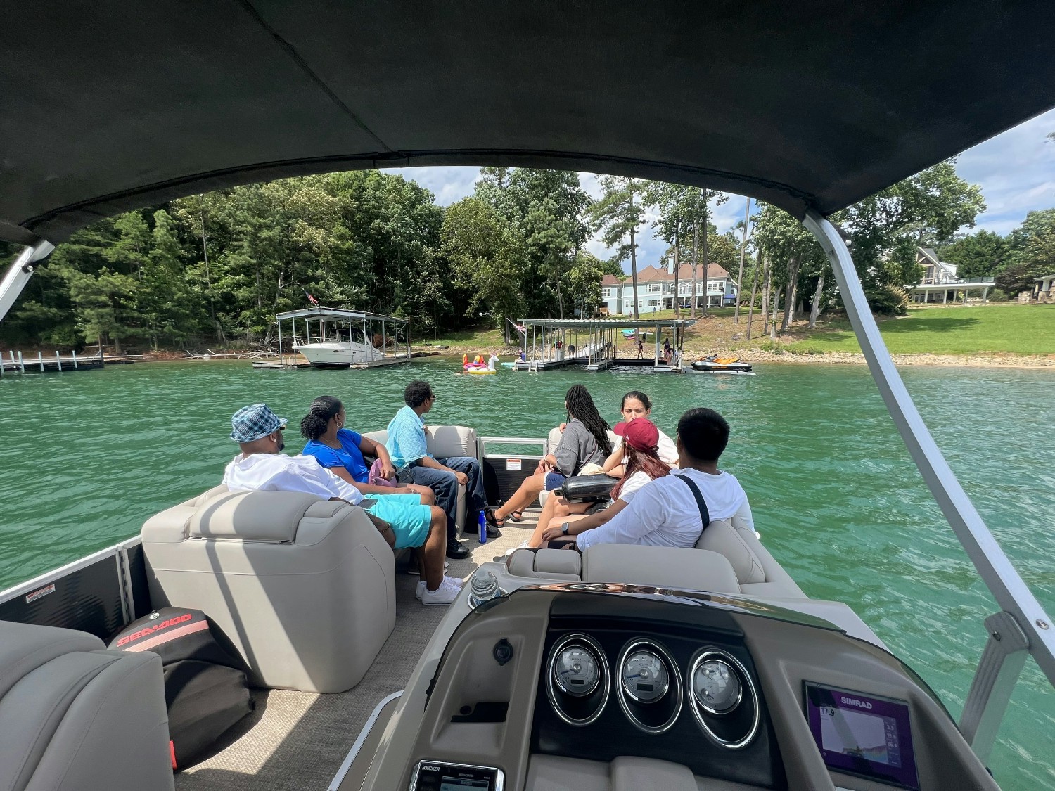 Some of the Trainz employees with their families enjoying the owners boat at one of our three annual summer parties.