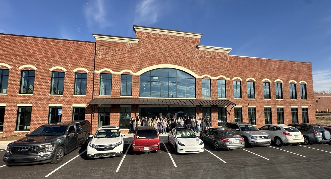 Trainz new warehouse dedication ceremony with a bunch of Team Members.