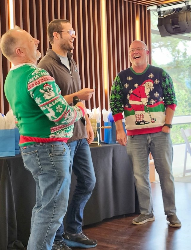 Members of our Executive Team share a laugh at our holiday event in Monterey, CA.
