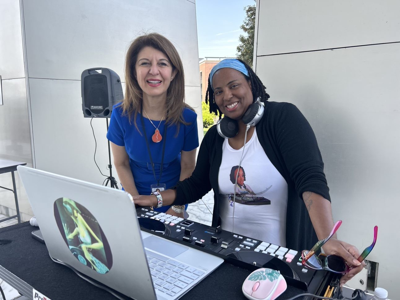 Richmond Fed Chief Information Officer Ghada Ijam and Fed employee DJ Dorian Henry at an employee appreciation event.