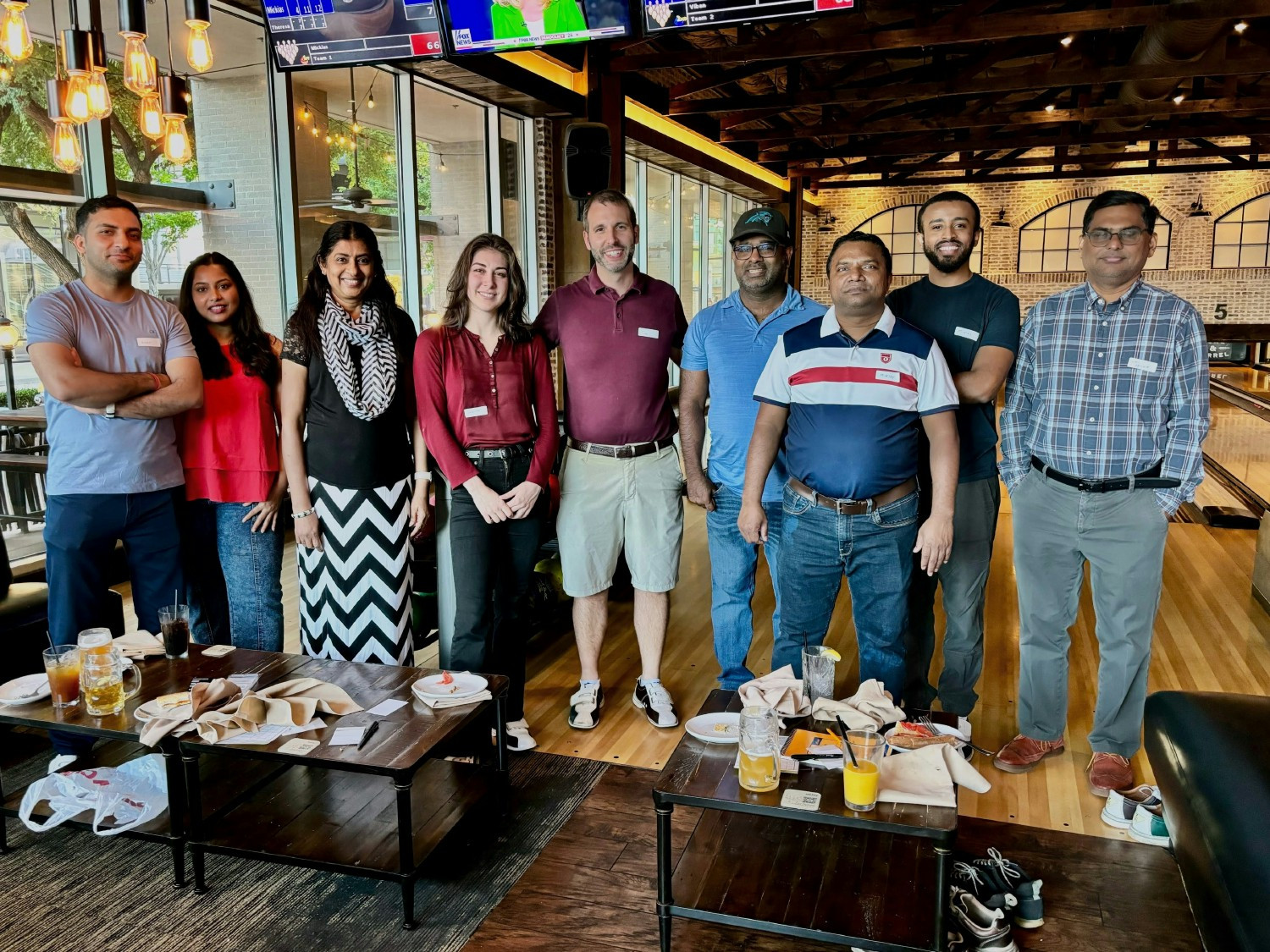 Altimetrik employees enjoying bowling.