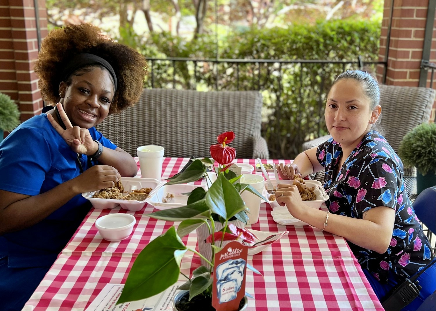 Two of our nurses enjoying a BBQ luncheon provided by Hillcrest