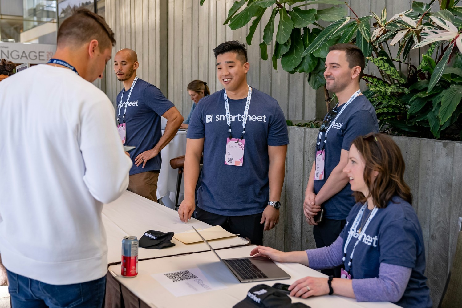 Smartsheet employees assist a customer at our annual ENGAGE conference.