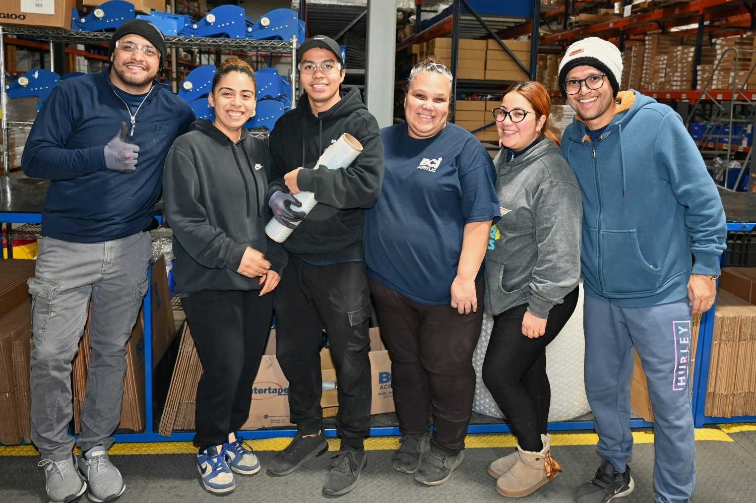 Standing strong and smiling bright! Bath Concepts employees know how to get the job done with a positive attitude!