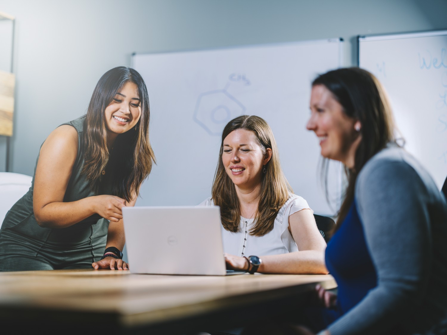 Collaboration at its finest - these coworkers come together to tackle a project and produce their best work.