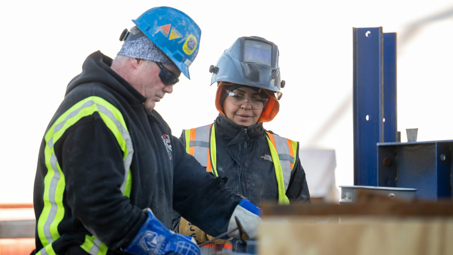 Employees providing welding services.