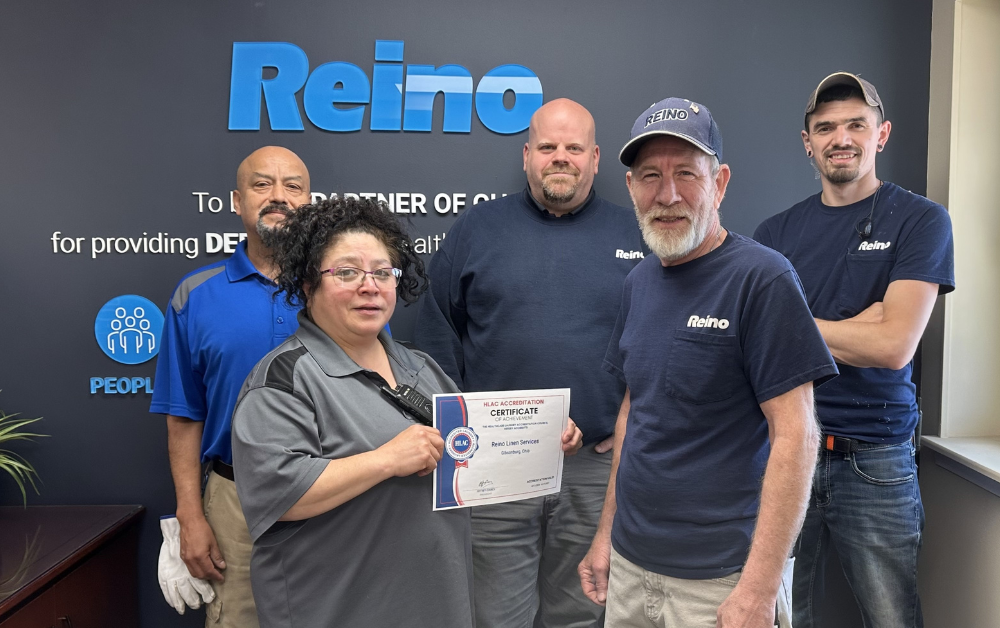 HLSG Reino team posing with their recent HLAC certification