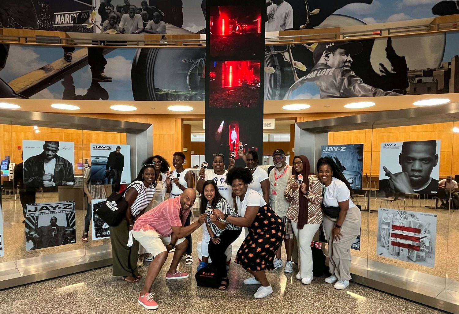 Vera's Black Verans Affinity Group visiting the Jay-Z exhibit at the Brooklyn Museum along with Flat Vera (our mascot).