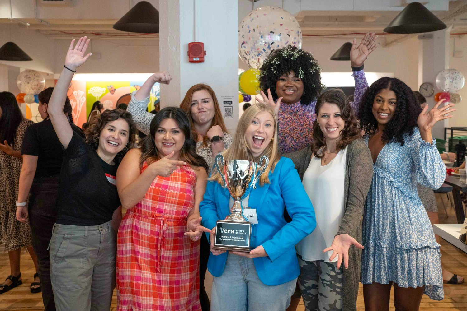 Vera's Unlocking Potential team celebrating their championship during Vera's Learning March Madness competition!