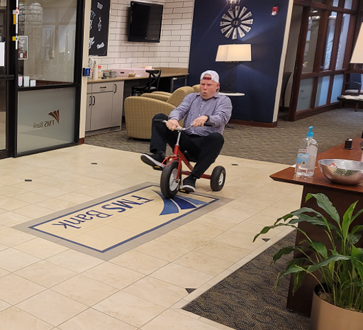 Our CEO participating in mini-bike time trails in the lobby