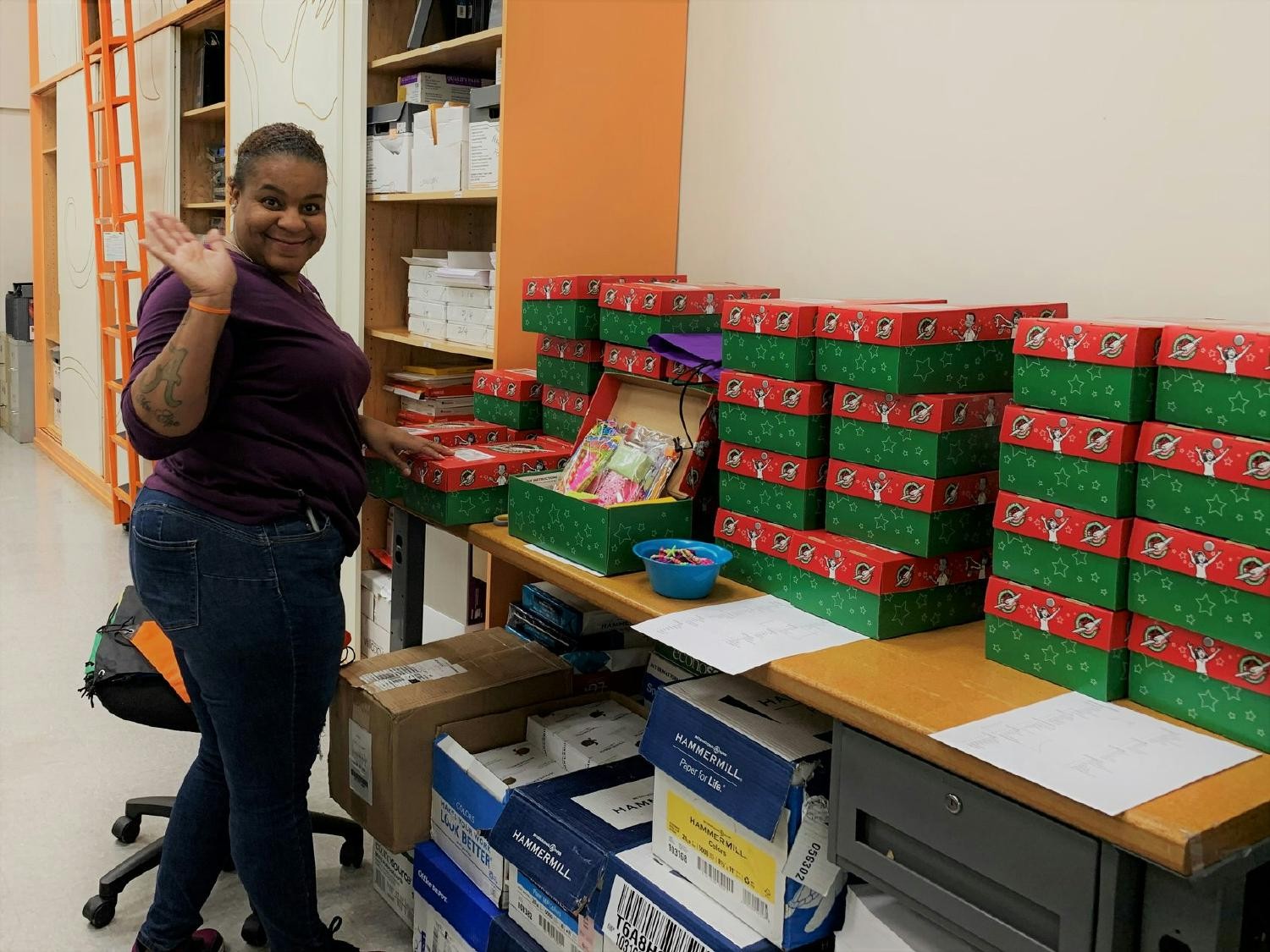Marquita prepares gifts for one of our community outreach programs. 