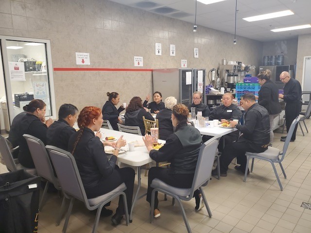 Banquet Servers eating dinner together during an event