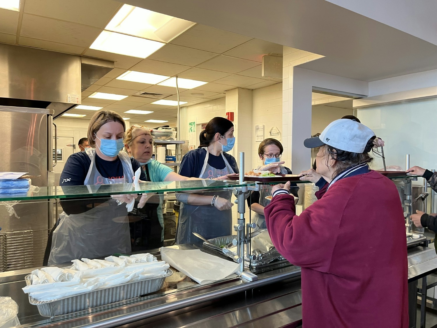 Volunteering serving food at New Covenant, Stamford