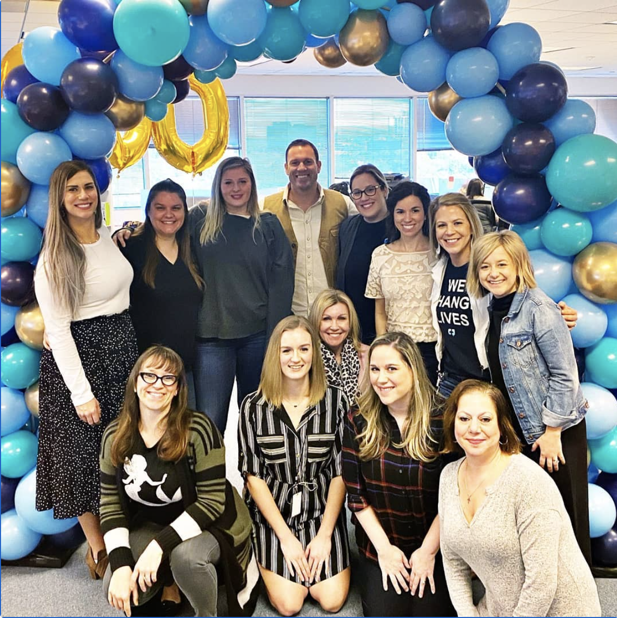 A few members of our nursing team with our CEO, celebrating a new record month of consultations!