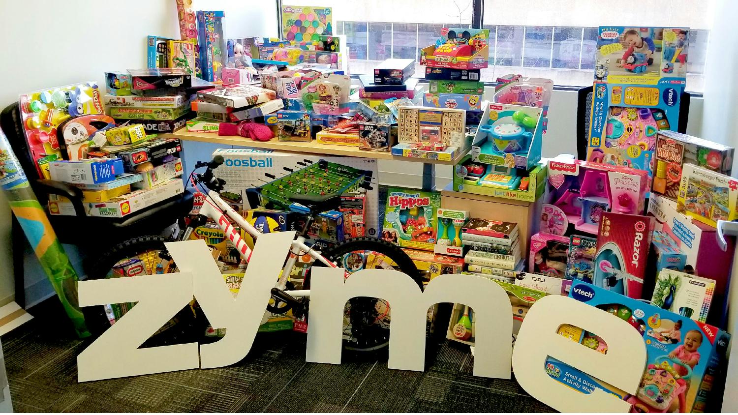 Zymers show their care for others through a number of fundraising events. Here is a picture of our annual toy drive.