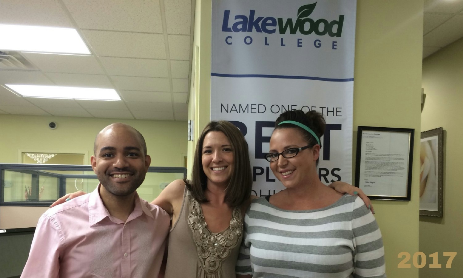 Tommy, Katy, and Alysia enjoy each other's company in the office. 