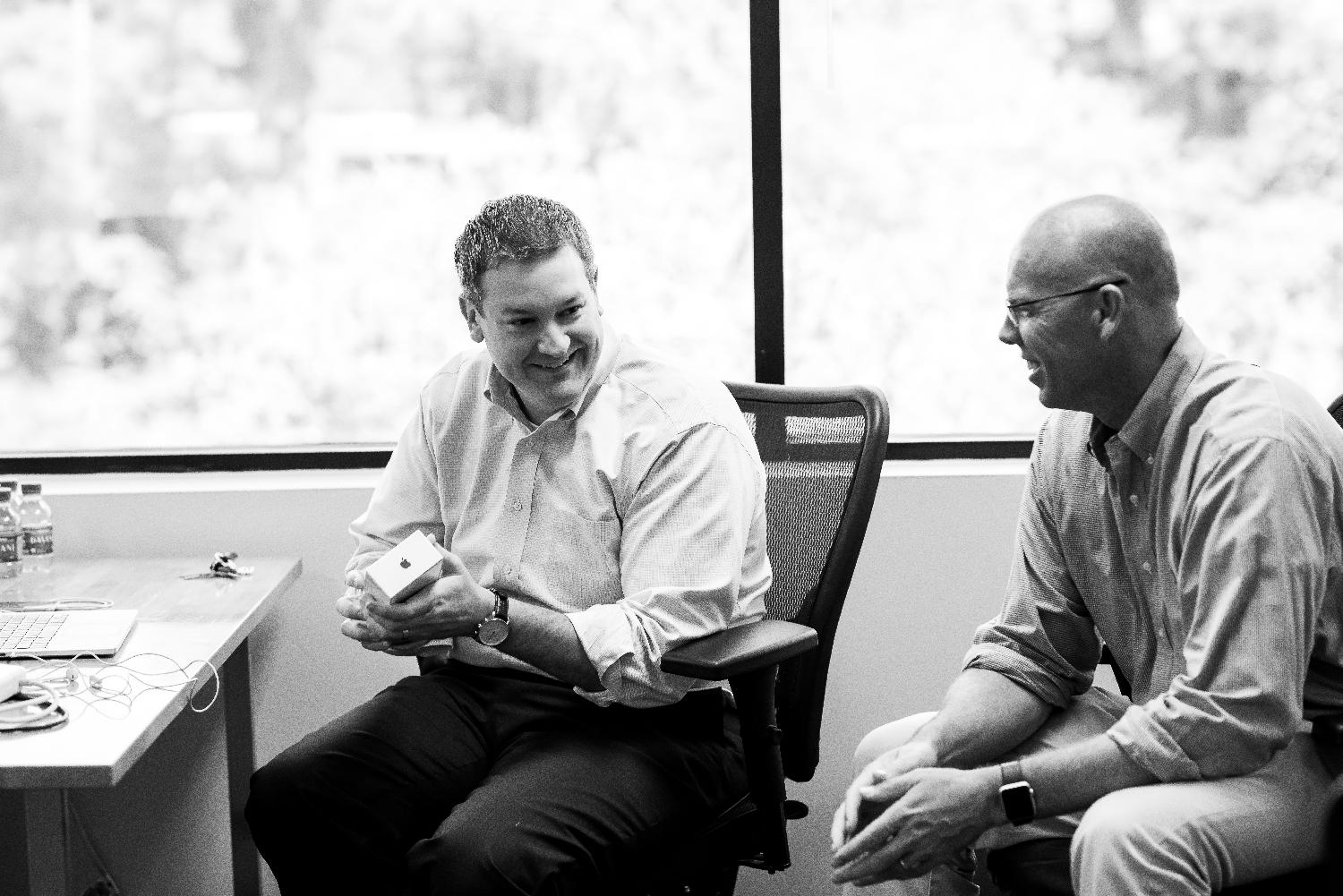 Working hard and sharing a laugh during a brainstorming session.