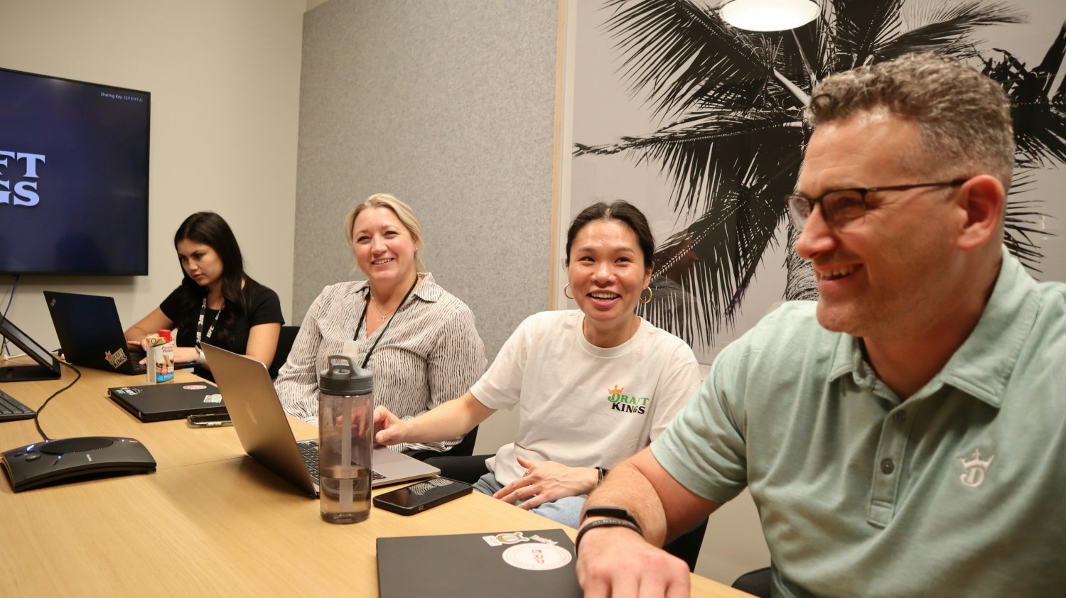 Team members meet together in one of our many conference rooms in our office spaces.