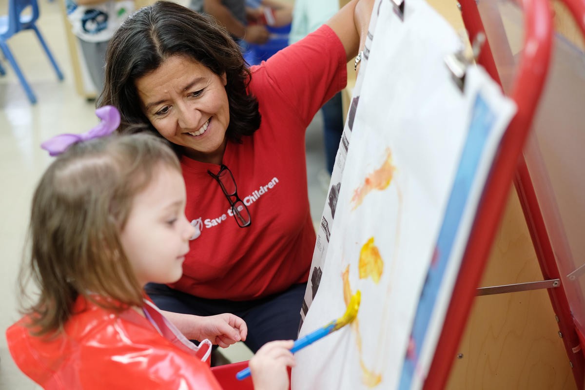 Head Start Student Paints with Save the Children's CEO  Janti Soeripto