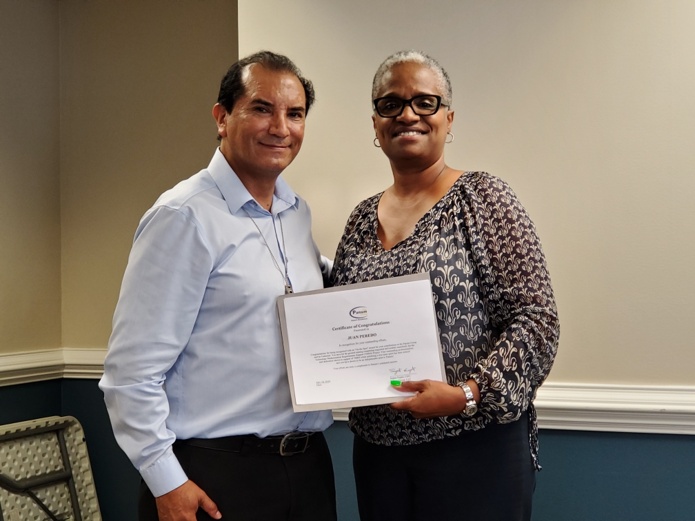 Panum Employee receiving one of our Quarterly Spot Awards- he went above and beyond in representing Panum and his team.