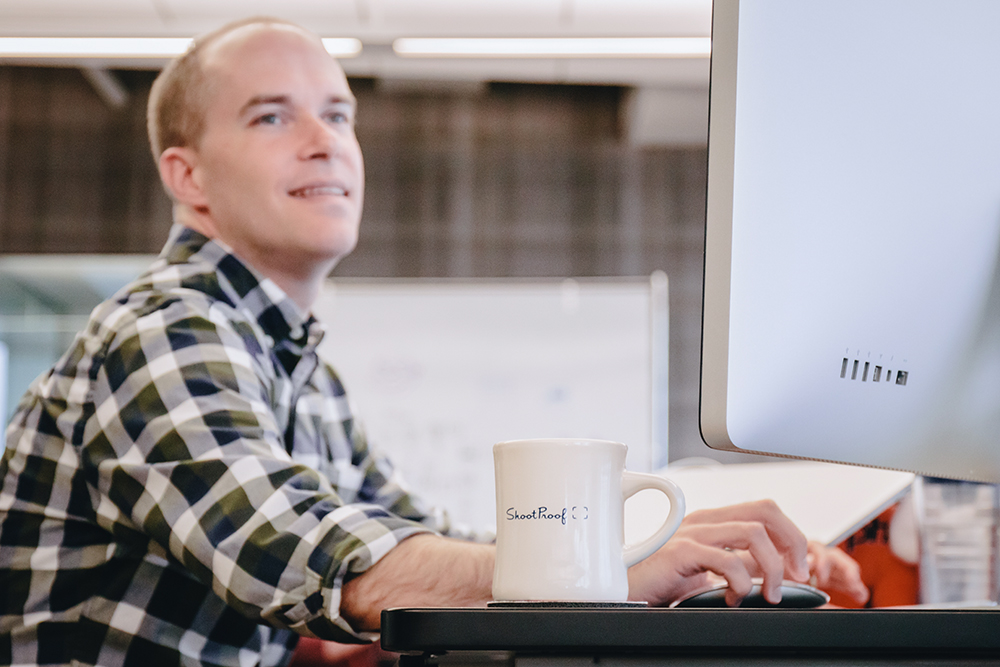 ShootProof Engineering team member enjoying a cup of coffee at work