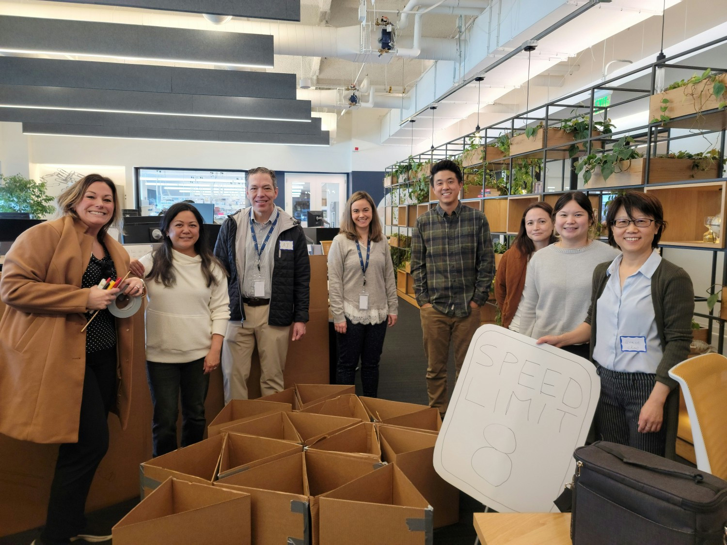 Our team building event, where all employees worked together to build a cardboard bridge that would hold up a golf cart!