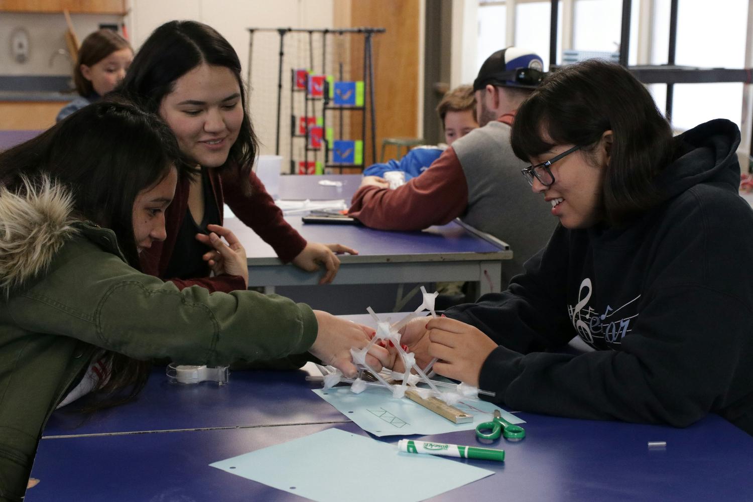 Our Assistant Engineer volunteering during Saturday School, a STEM program for high school students in Bakersfield.