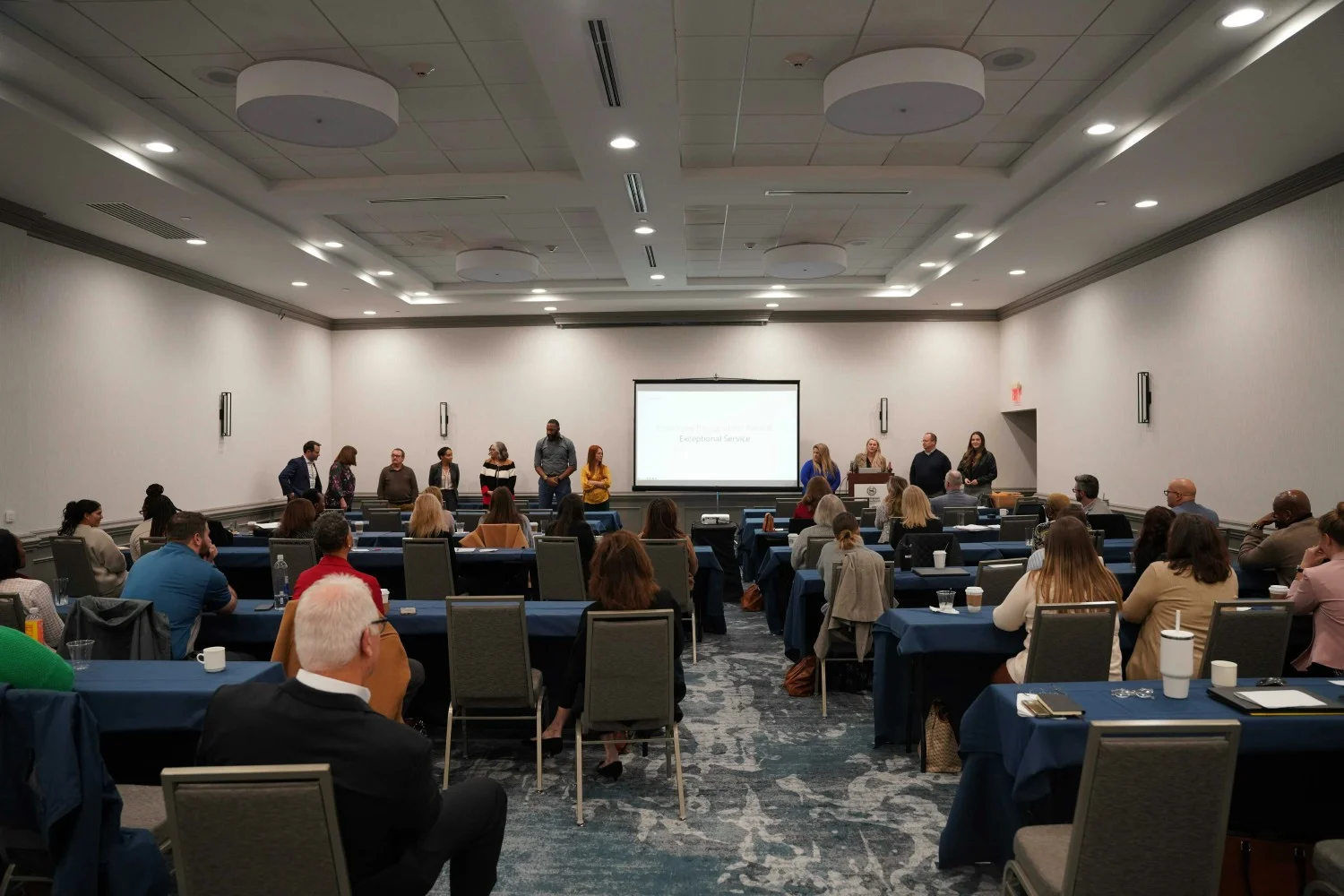 STRATEGIC ALIGNMENT: Annual summit unites organization for strategic planning. Department heads present achievements. 