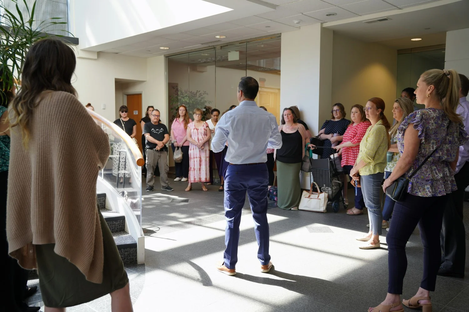 LEADERSHIP: CEO shares inspiring vision at new office ribbon cutting, emphasizing growth trajectory and our new space. 