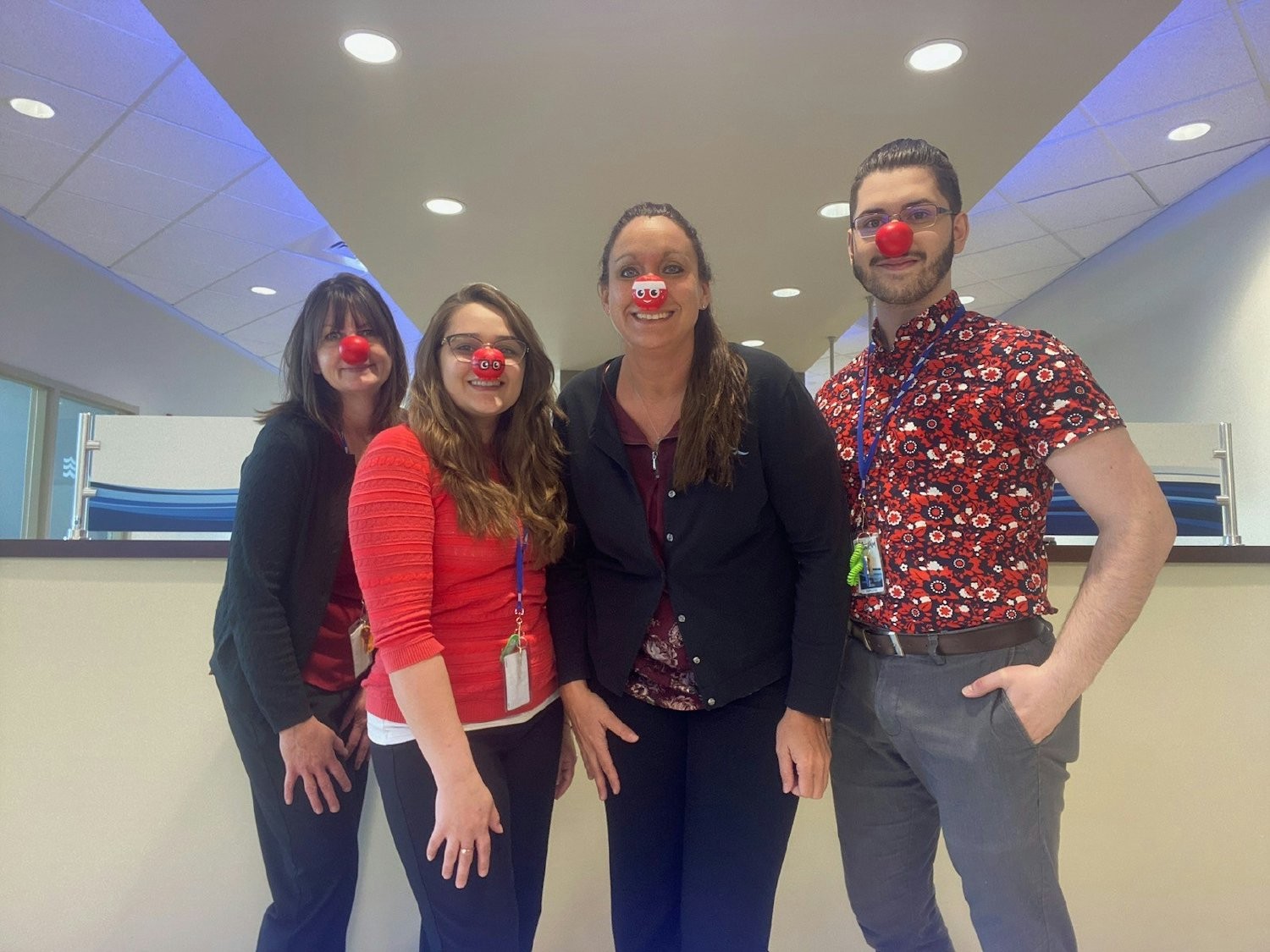 Employees participate in the National Red Nose Day to help end child poverty.