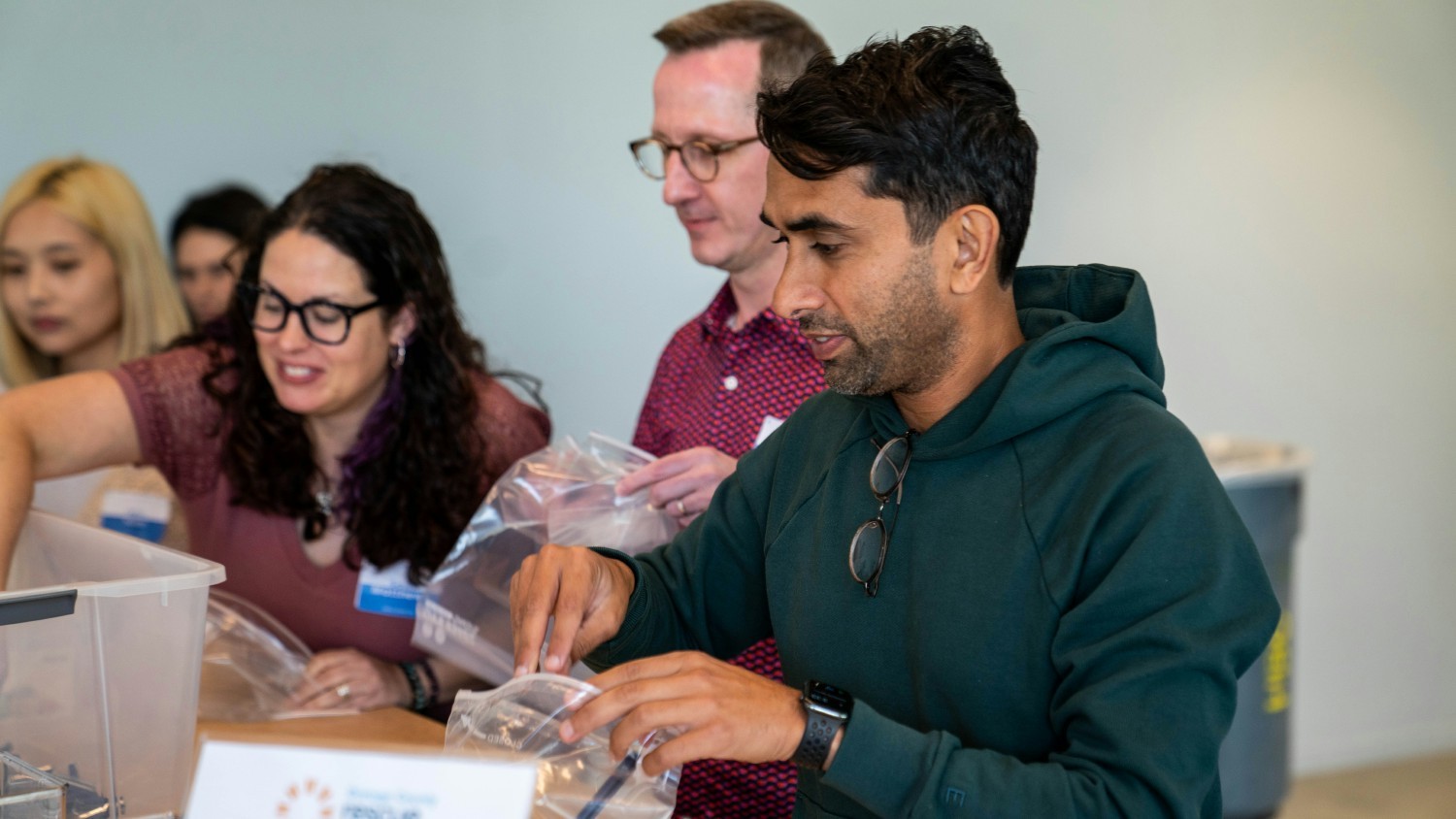 Kajabi’s CEO, Ahad Khan, assembling hygiene kit for the homeless during Kajabi Onsite.