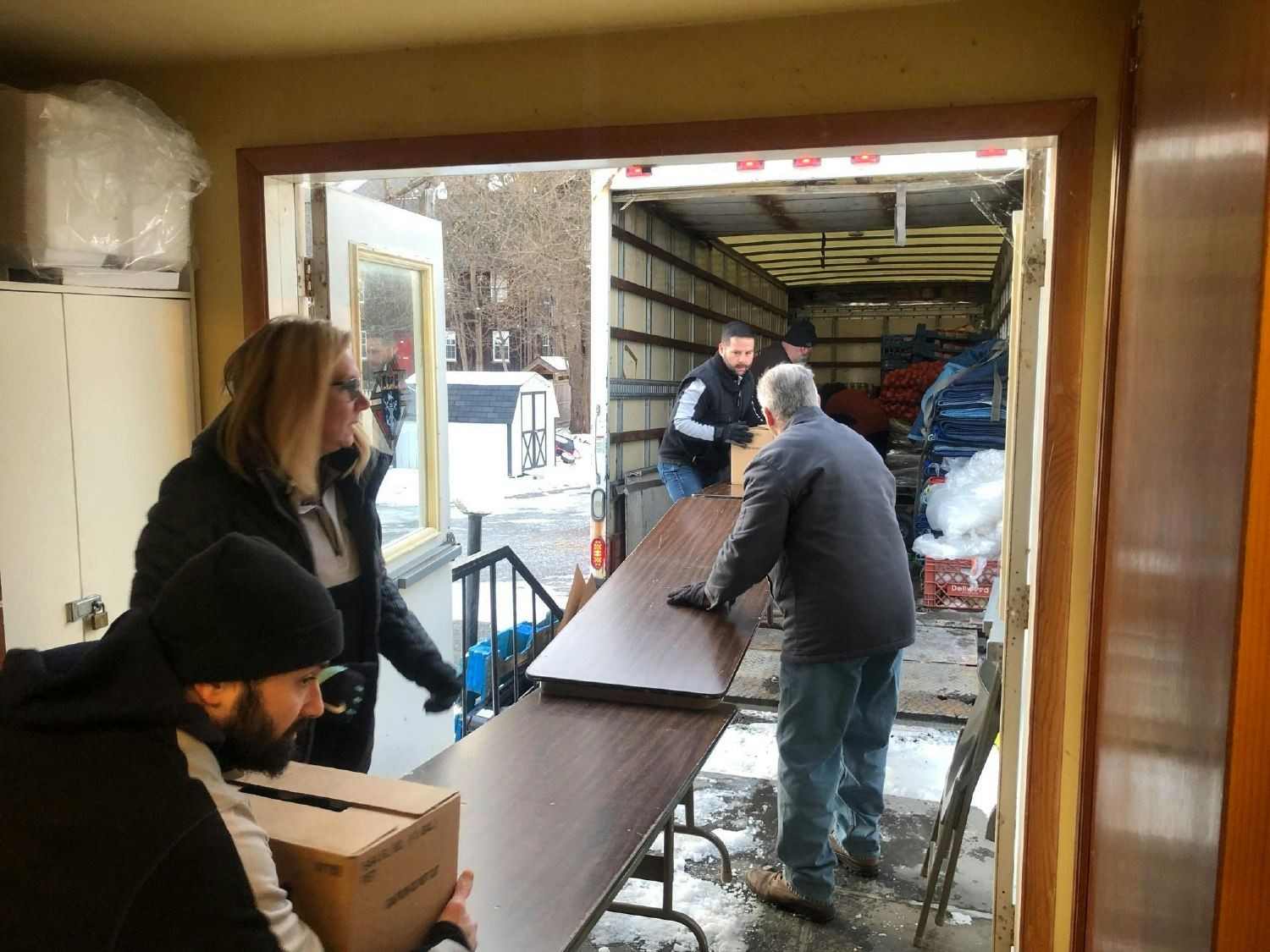 CEO, Brett Melchin, and employees volunteer at local food banks around the holiday season.